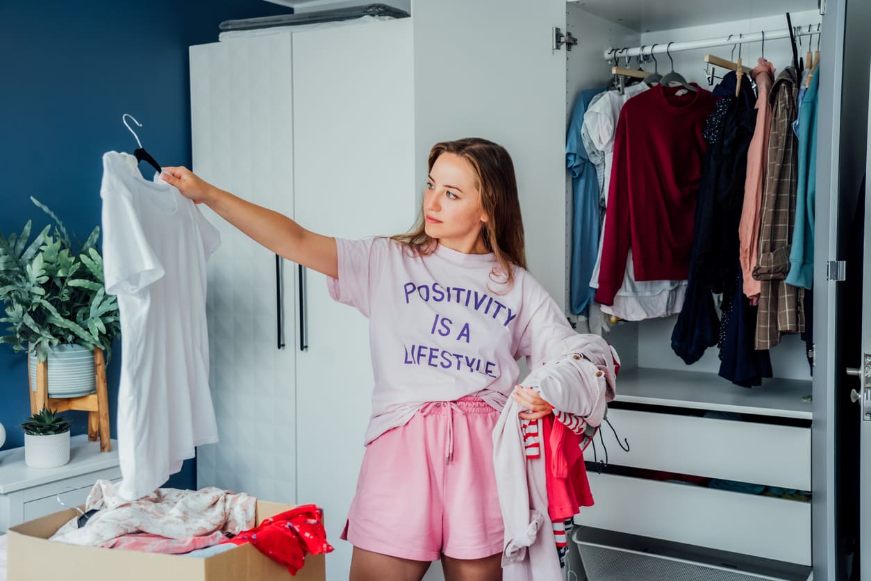 Eurolife blog - home decluttering woman organizing wardrobe
