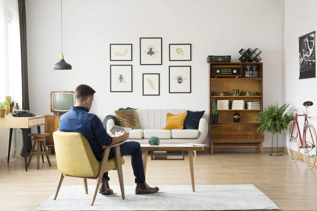 Eurolife blog - man reading a magazine at his retro modern living room