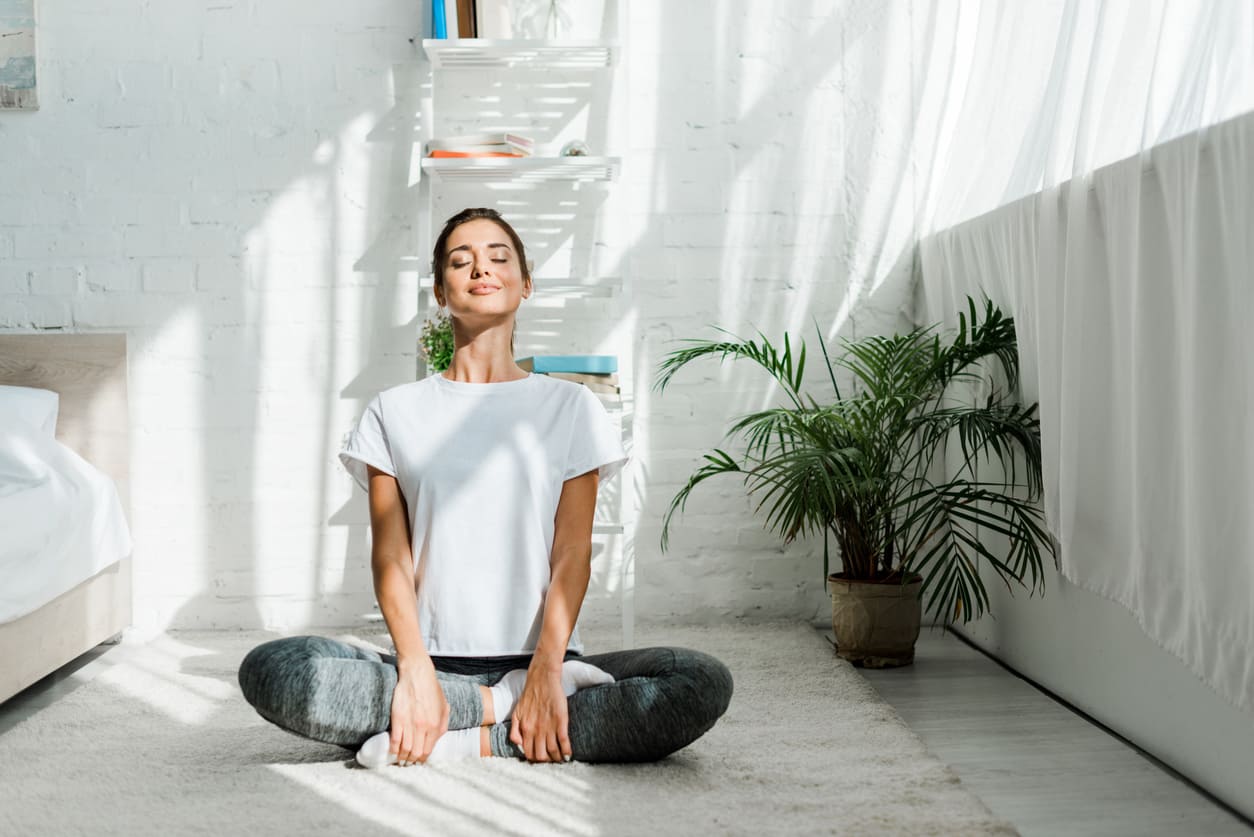 Eurolife blog - woman practicing yoga at home