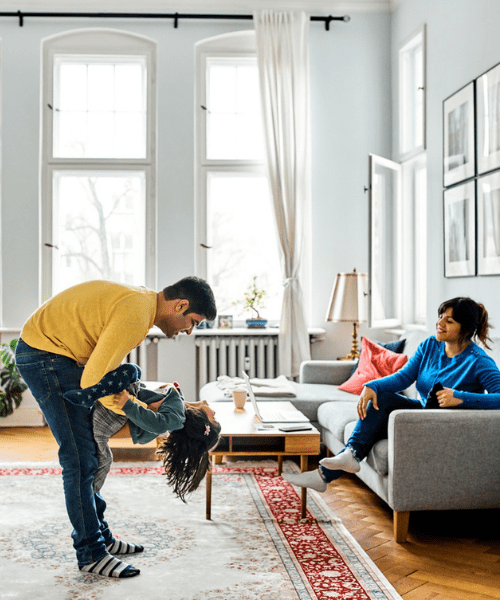 man-playing-with-daughter-in-living-room-picture-eurolife_katoikia_sweet_home_content_mobile